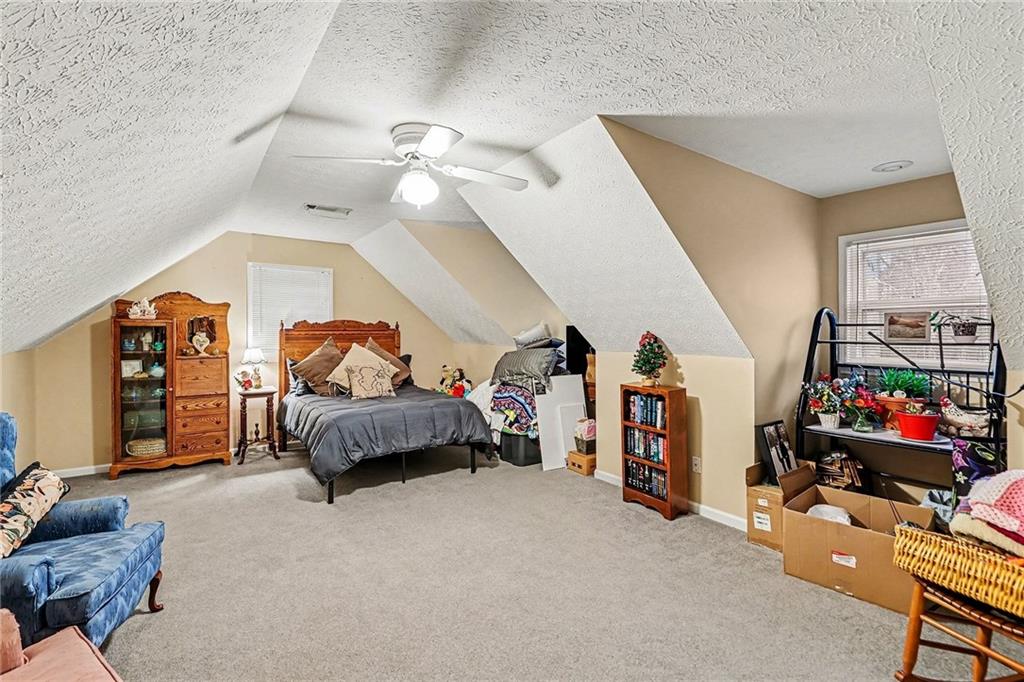 7537 Berea Road Winston, GA 30187 - Photo 27 of 37 a bedroom with furniture and a bed