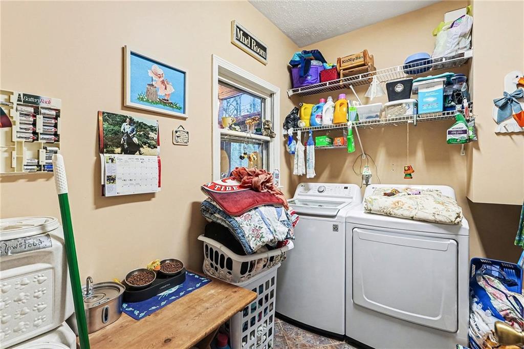 7537 Berea Road Winston, GA 30187 - Photo 28 of 34 a storage room with washer and dryer