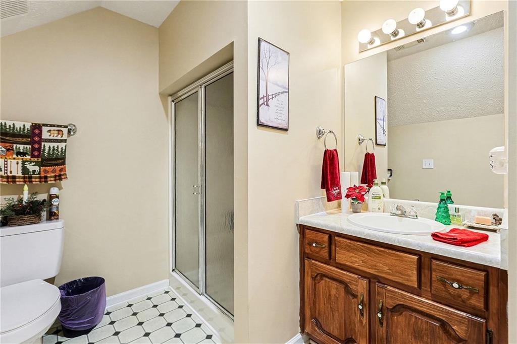 7537 Berea Road Winston, GA 30187 - Photo 29 of 37 a bathroom with a sink vanity mirror and toilet