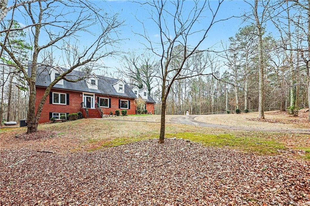 7537 Berea Road Winston, GA 30187 - Photo 3 of 34 a view of a yard with a large tree