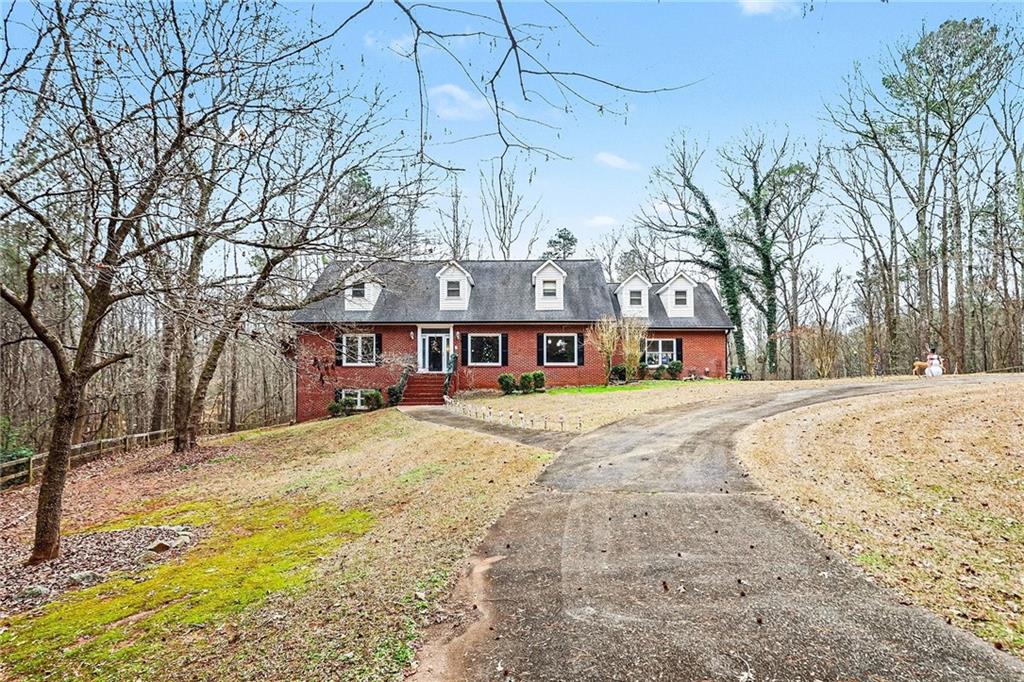 7537 Berea Road Winston, GA 30187 - Photo 3 of 37 a front view of a building with a yard covered with snow