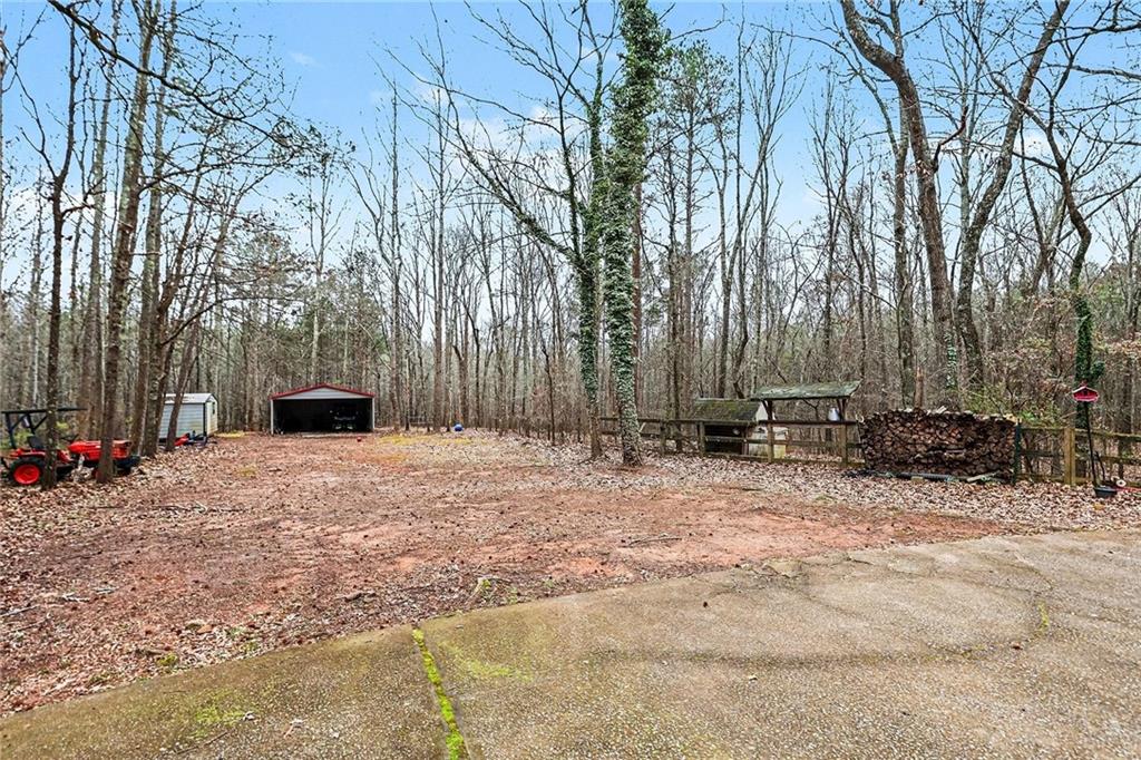 7537 Berea Road Winston, GA 30187 - Photo 34 of 34 a backyard of a house with parked trees