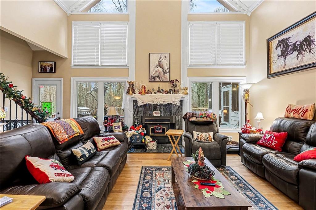 7537 Berea Road Winston, GA 30187 - Photo 6 of 37 a living room with furniture fireplace and a window