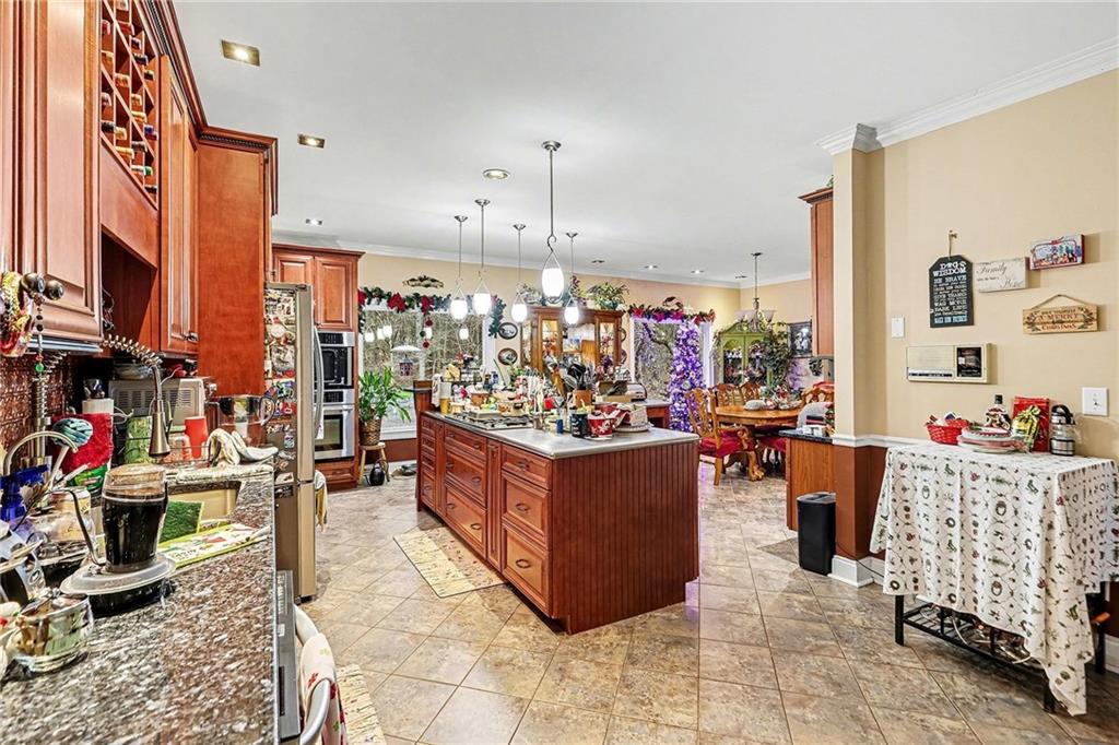 7537 Berea Road Winston, GA 30187 - Photo 8 of 34 a living room filled with furniture and a chandelier