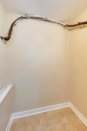 a bathroom with a shower and white floor