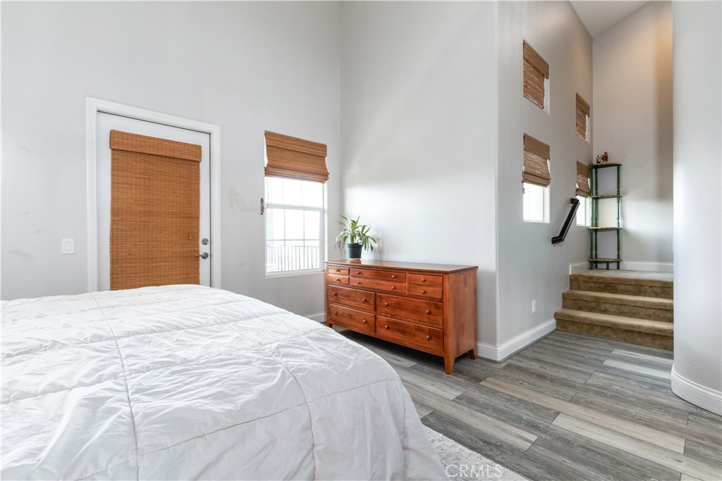 9354 Riberena Circle Atascadero, CA 93422 - Photo 32 of 47 a bedroom with a bed and wooden floor