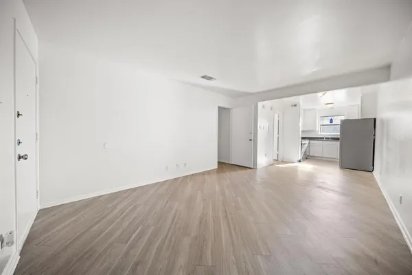 a white refrigerator freezer sitting inside of a kitchen