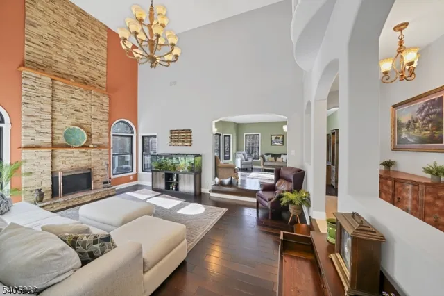 a living room with furniture fireplace and flat screen tv