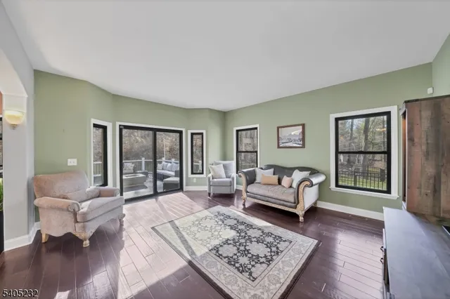 a living room with furniture and a rug