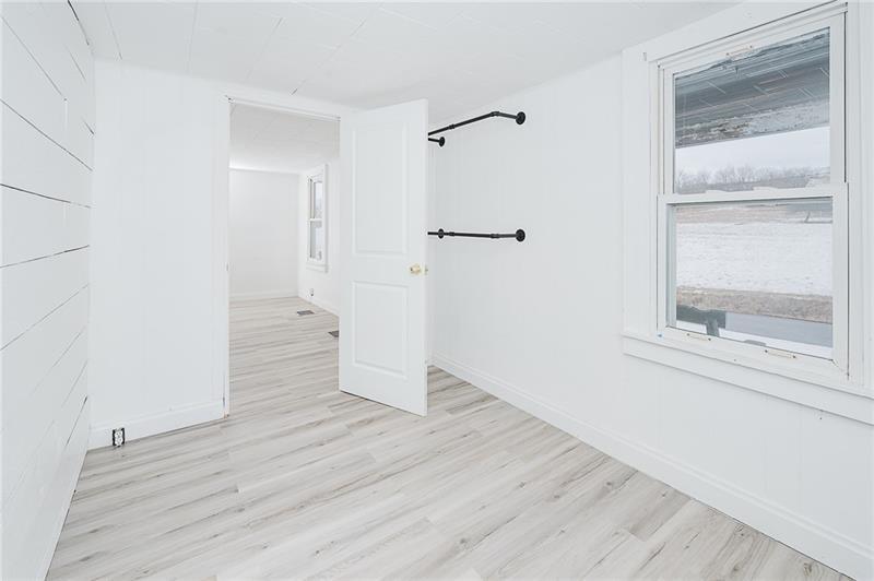 336 Walkchalk Road Kittanning, PA 16201 - Photo 15 of 49 a view of an empty room with wooden floor and a window