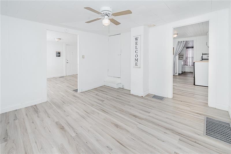 336 Walkchalk Road Kittanning, PA 16201 - Photo 17 of 49 wooden floor in an empty room with a window