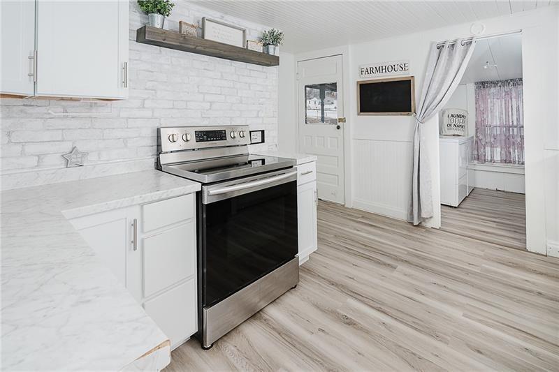 336 Walkchalk Road Kittanning, PA 16201 - Photo 20 of 49 a kitchen with cabinets and steel appliances