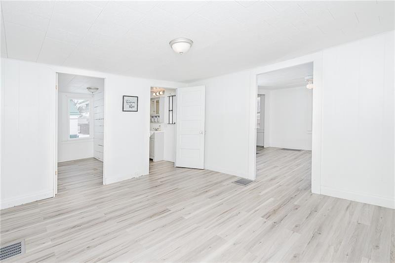 336 Walkchalk Road Kittanning, PA 16201 - Photo 10 of 49 an empty room with wooden floor & windows
