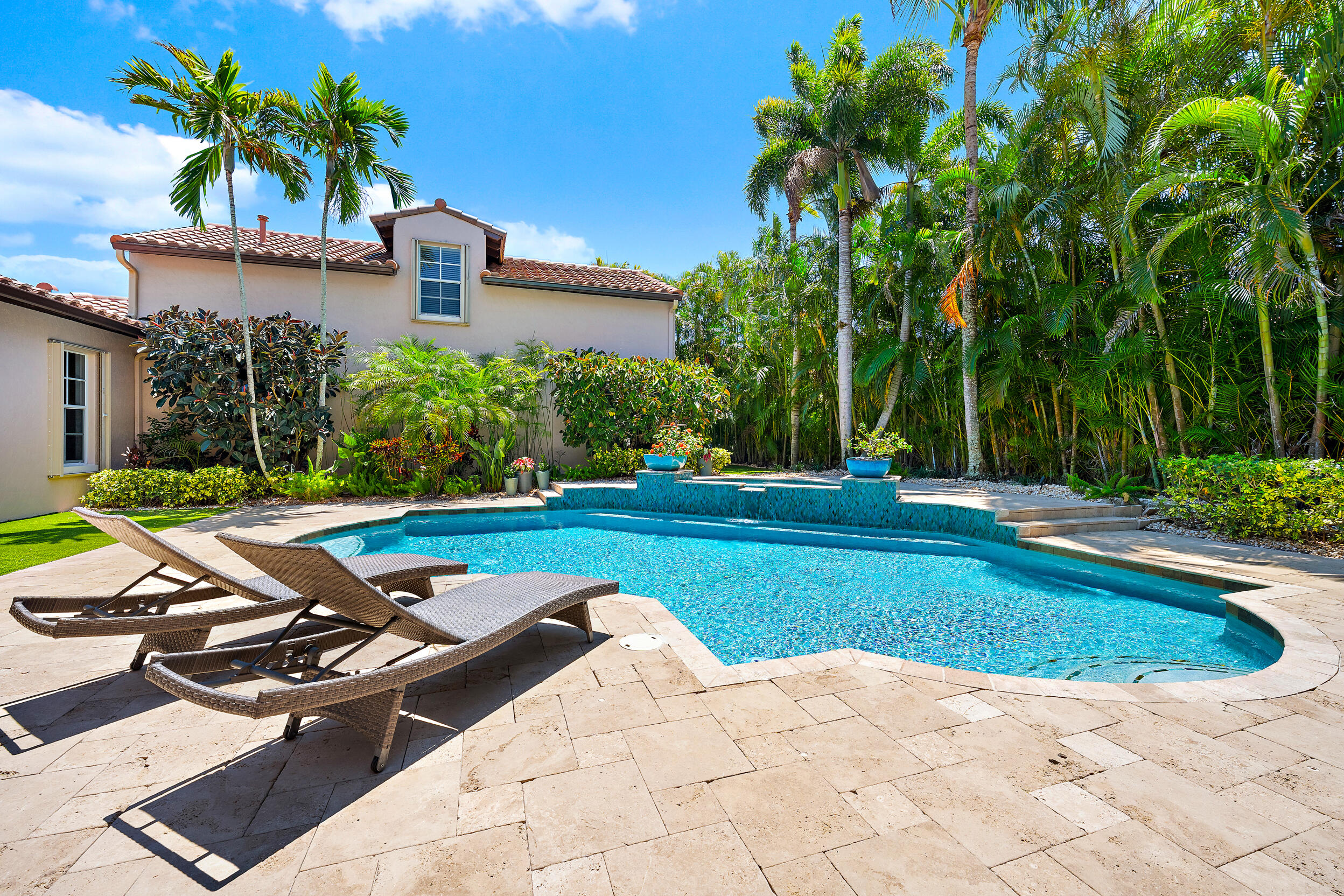 105 Segovia Way Jupiter, FL 33458 - Photo 3 of 33 a view of backyard with swimming pool and outdoor seating
