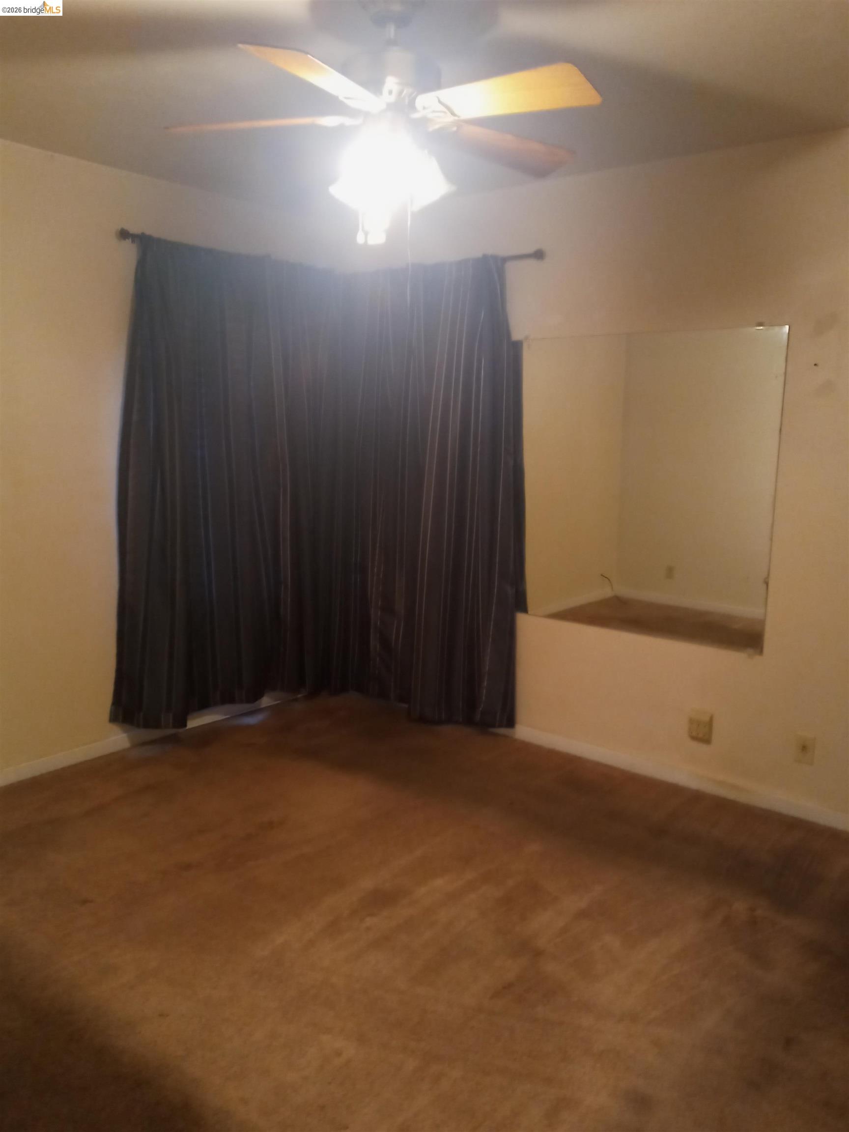 462 Springs Road Vallejo, CA 94590 - Photo 5 of 9 Carpeted interior space featuring a ceiling fan with integrated lighting