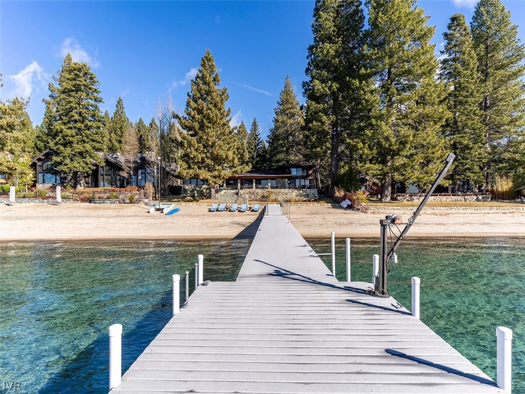 a view of a house with yard and tree s