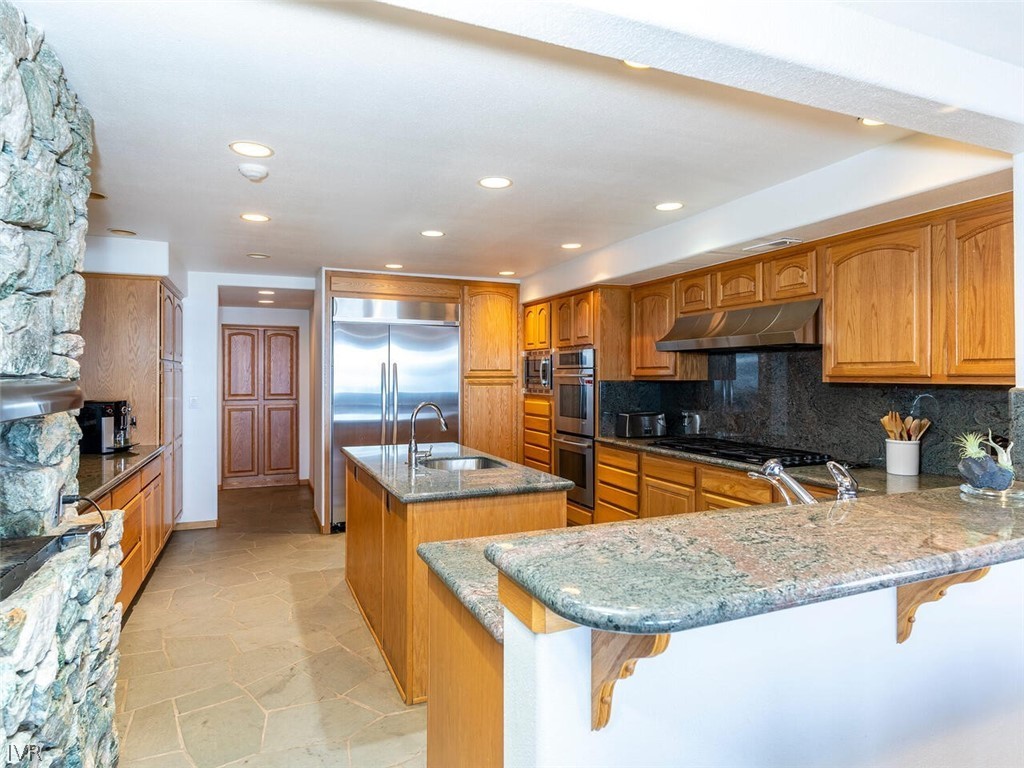 949 Lakeshore Boulevard Incline Village, NV 89451 - Photo 12 of 33 a kitchen with stainless steel appliances granite countertop a sink a stove and a refrigerator