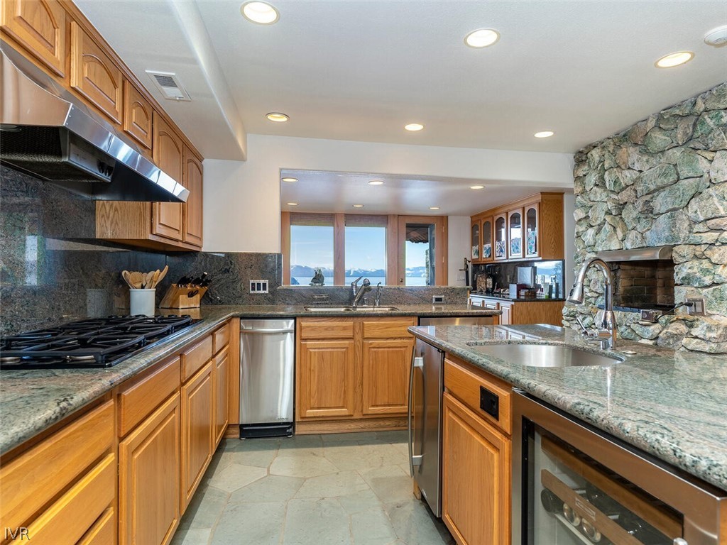 949 Lakeshore Boulevard Incline Village, NV 89451 - Photo 13 of 33 a kitchen with stainless steel appliances granite countertop a sink and stove
