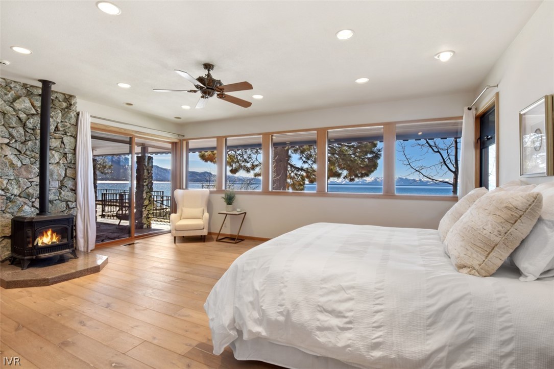 949 Lakeshore Boulevard Incline Village, NV 89451 - Photo 16 of 33 a spacious bedroom with a large bed and a flat screen tv