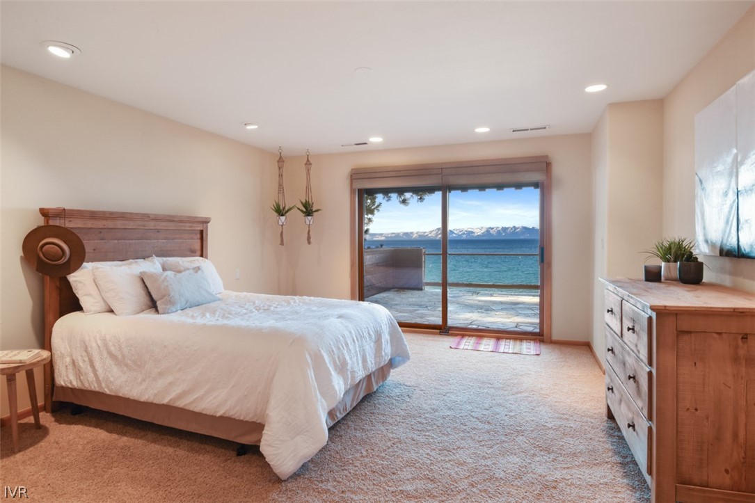 949 Lakeshore Boulevard Incline Village, NV 89451 - Photo 19 of 33 a bedroom with a large bed and a large window