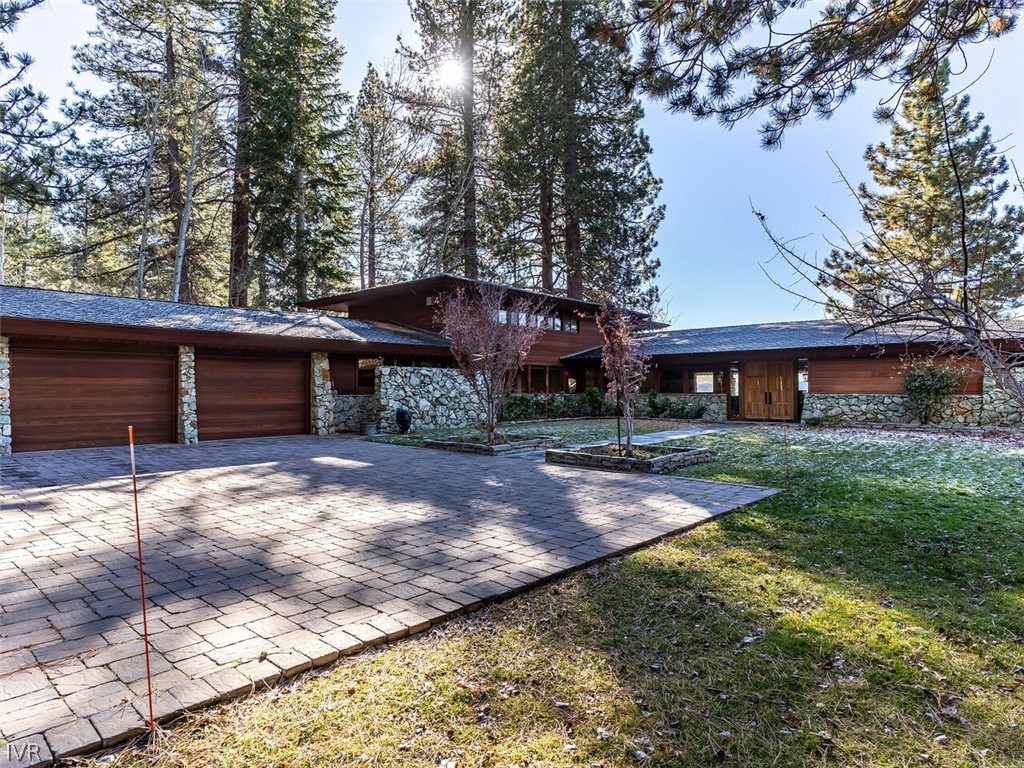 949 Lakeshore Boulevard Incline Village, NV 89451 - Photo 23 of 33 a front view of a house with a yard and garage