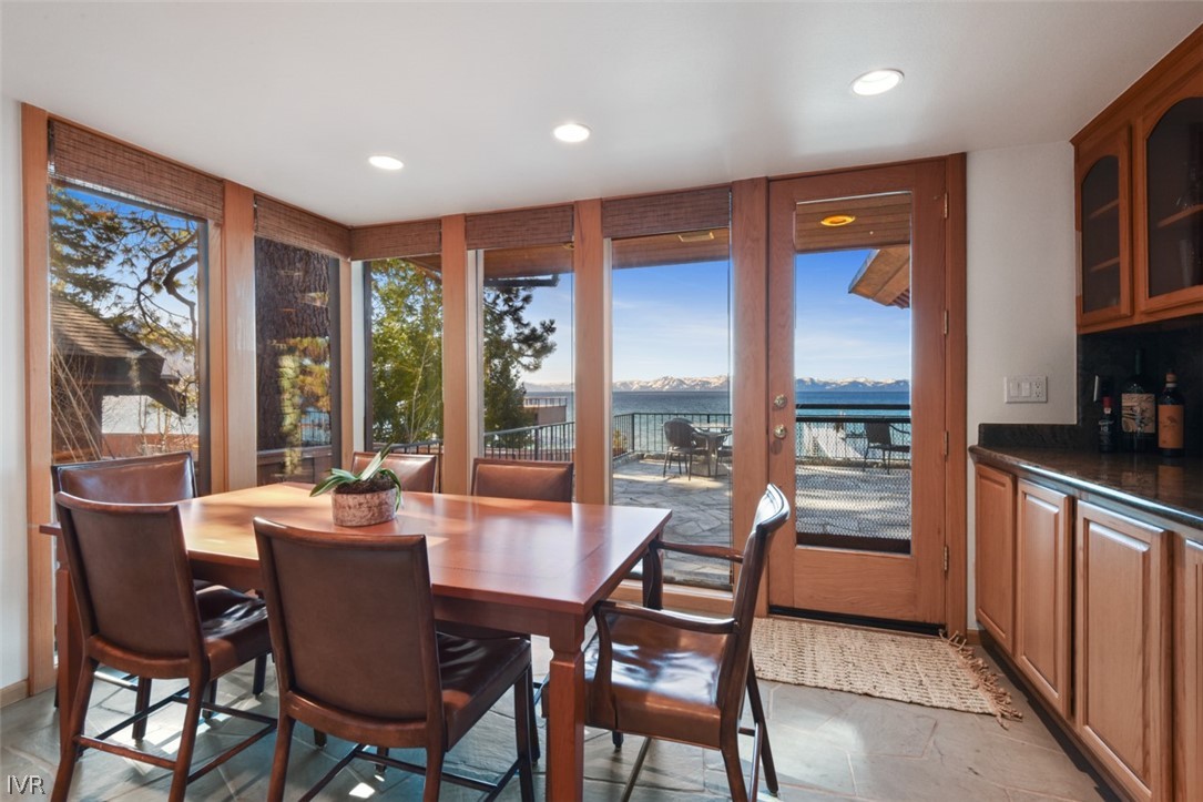 949 Lakeshore Boulevard Incline Village, NV 89451 - Photo 10 of 33 a dining room with furniture a flat screen tv and a floor to ceiling window