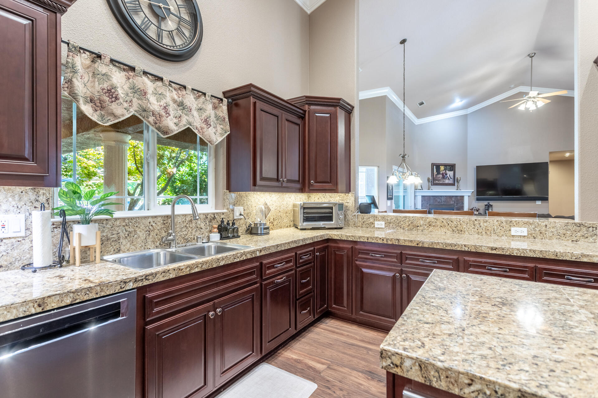 7307 Del Rico Court Palo Cedro, CA 96073 - Photo 14 of 55 a kitchen with stainless steel appliances granite countertop a sink and a stove
