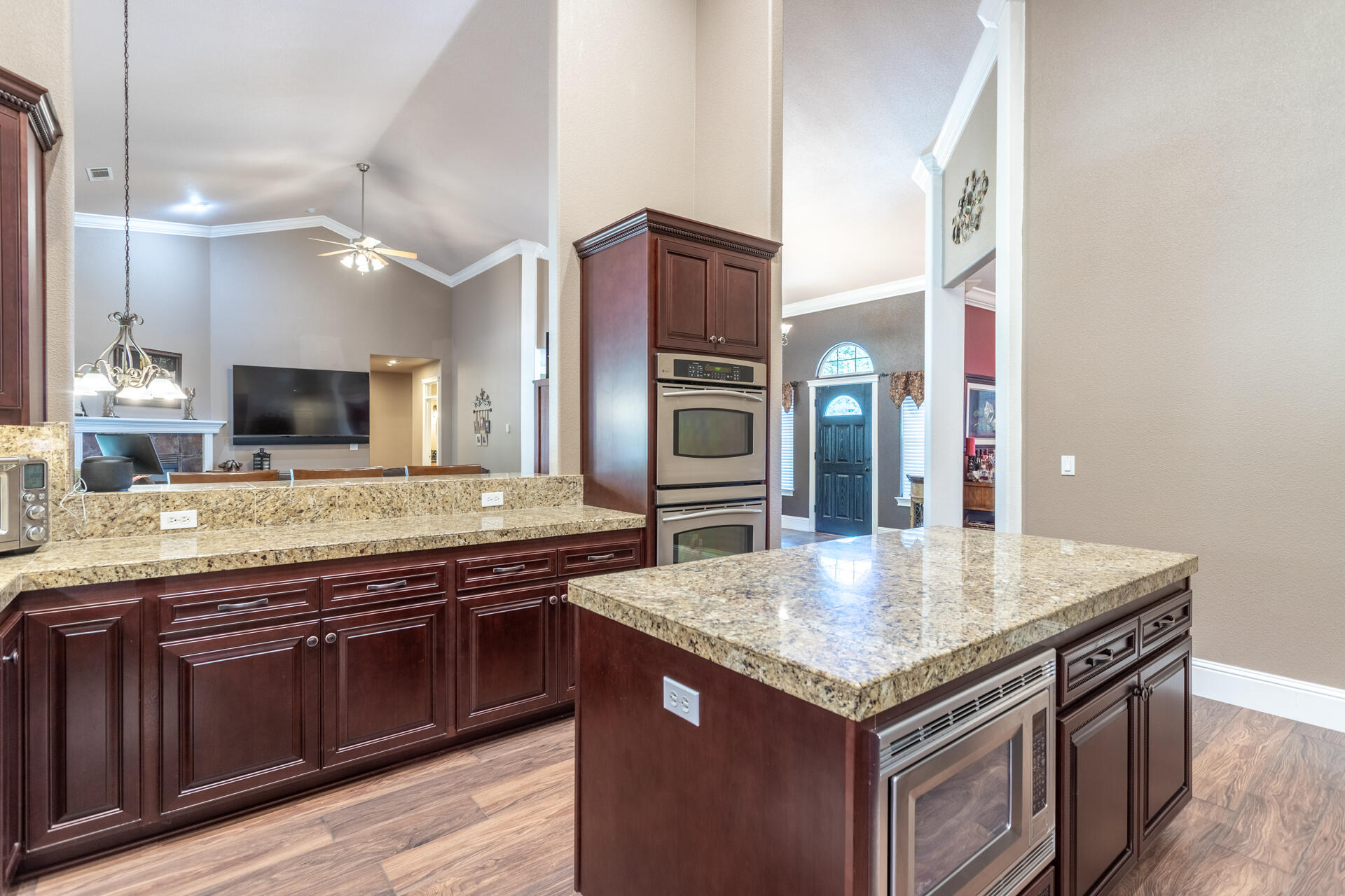 7307 Del Rico Court Palo Cedro, CA 96073 - Photo 15 of 55 a kitchen with stainless steel appliances granite countertop stove top oven and refrigerator