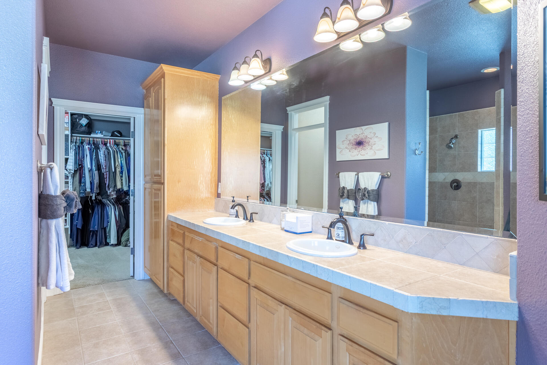 7307 Del Rico Court Palo Cedro, CA 96073 - Photo 19 of 55 a bathroom with a double vanity sink and a mirror