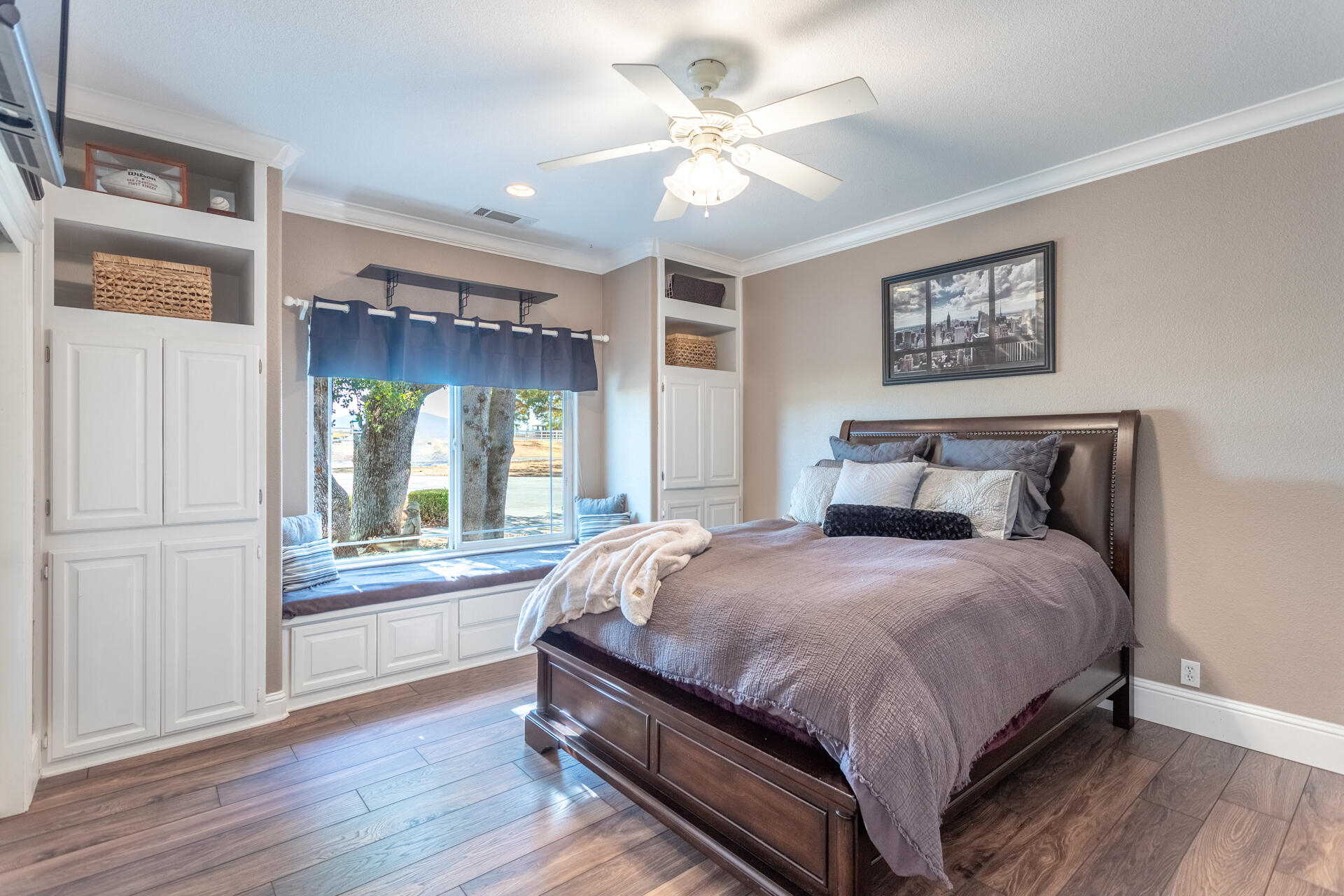 7307 Del Rico Court Palo Cedro, CA 96073 - Photo 23 of 55 a large bedroom with a large bed and a chandelier