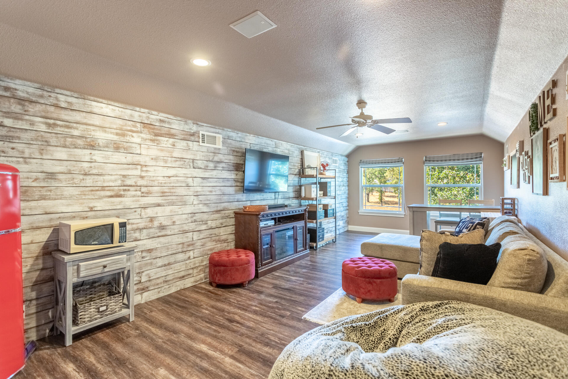 7307 Del Rico Court Palo Cedro, CA 96073 - Photo 27 of 55 a bedroom with furniture and a fireplace