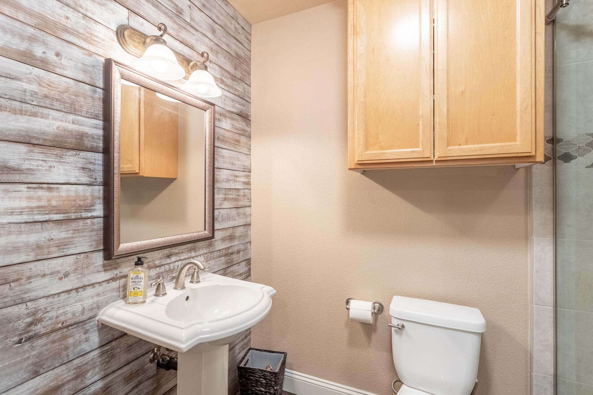 7307 Del Rico Court Palo Cedro, CA 96073 - Photo 29 of 55 a bathroom with a sink a toilet and mirror
