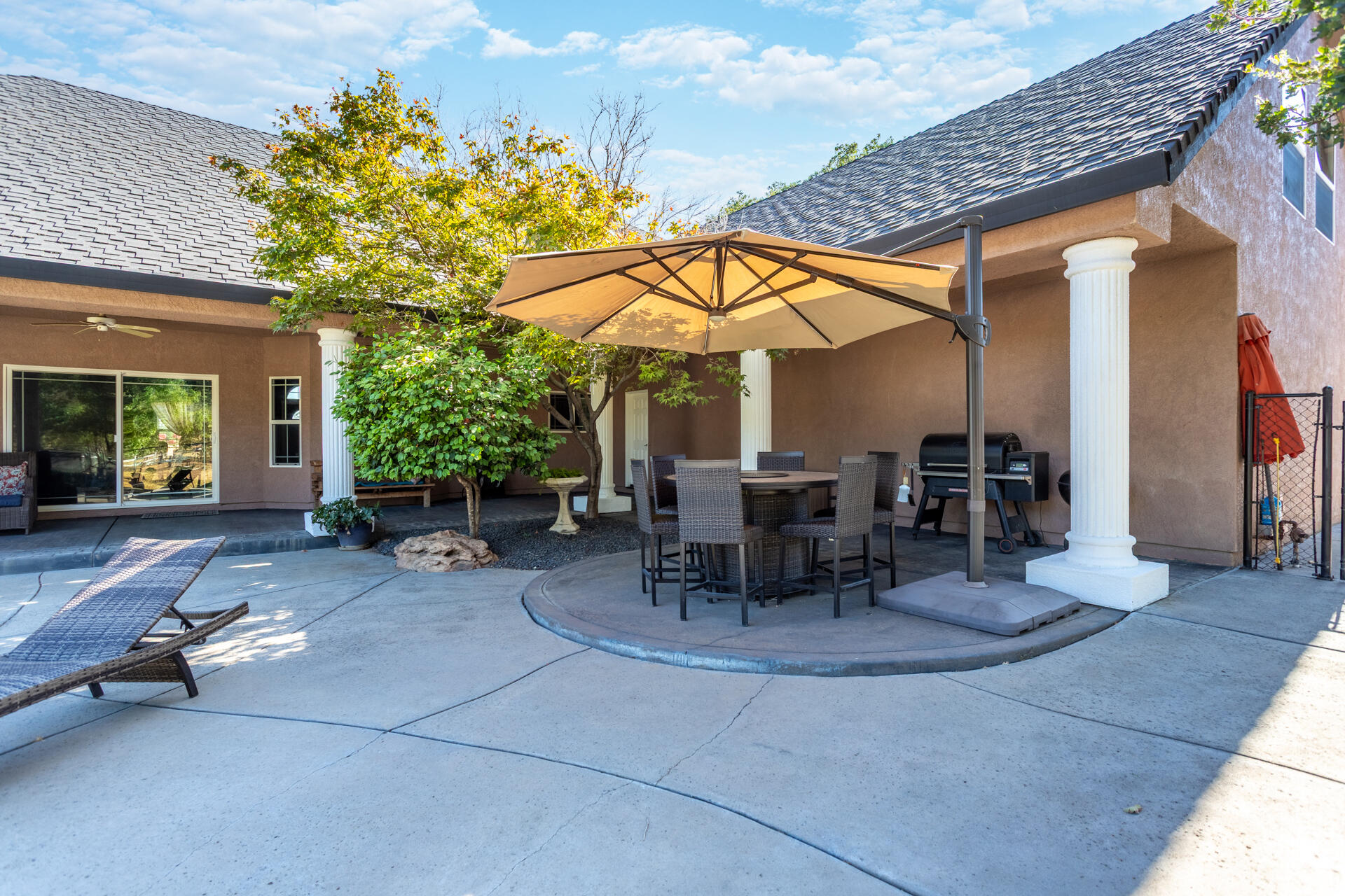 7307 Del Rico Court Palo Cedro, CA 96073 - Photo 36 of 55 a view of a patio with a table and chairs and potted plants
