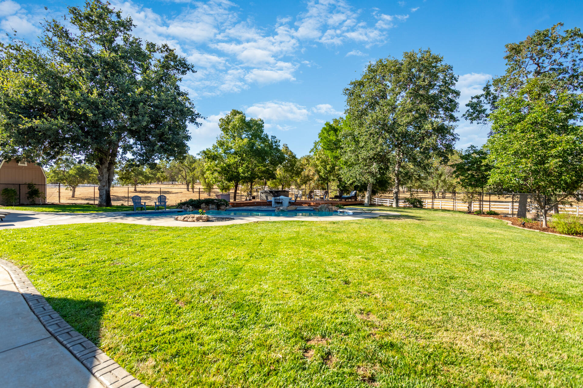 7307 Del Rico Court Palo Cedro, CA 96073 - Photo 40 of 55 a view of swimming pool with an outdoor space and seating area