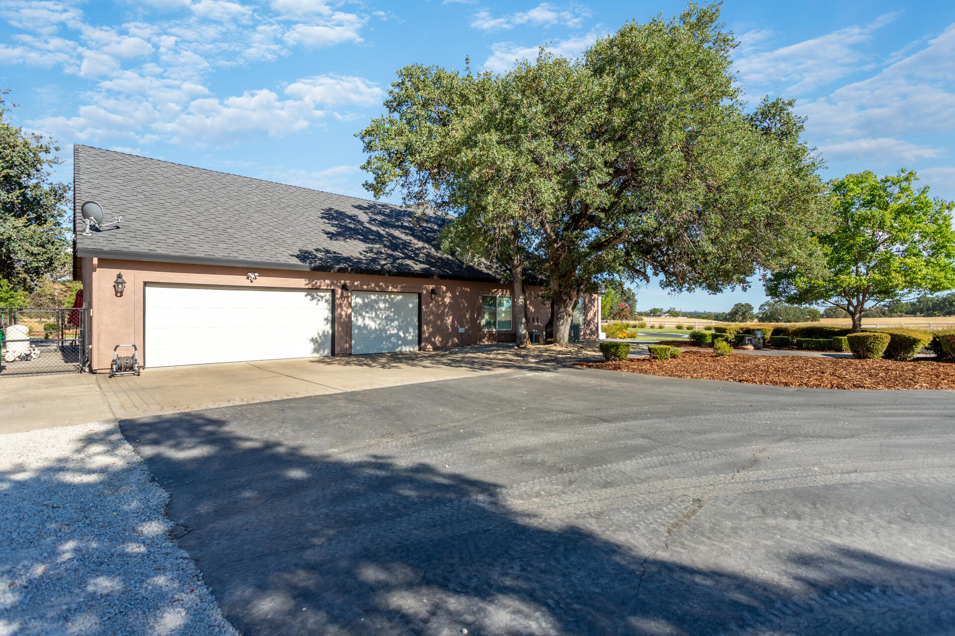7307 Del Rico Court Palo Cedro, CA 96073 - Photo 41 of 55 a view of city street with a building and trees in the background