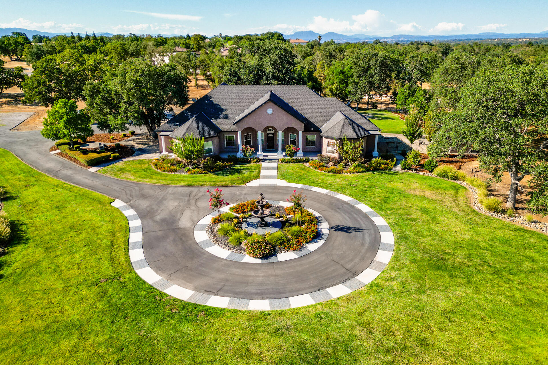 7307 Del Rico Court Palo Cedro, CA 96073 - Photo 51 of 55 a view of a house with a yard and sitting area