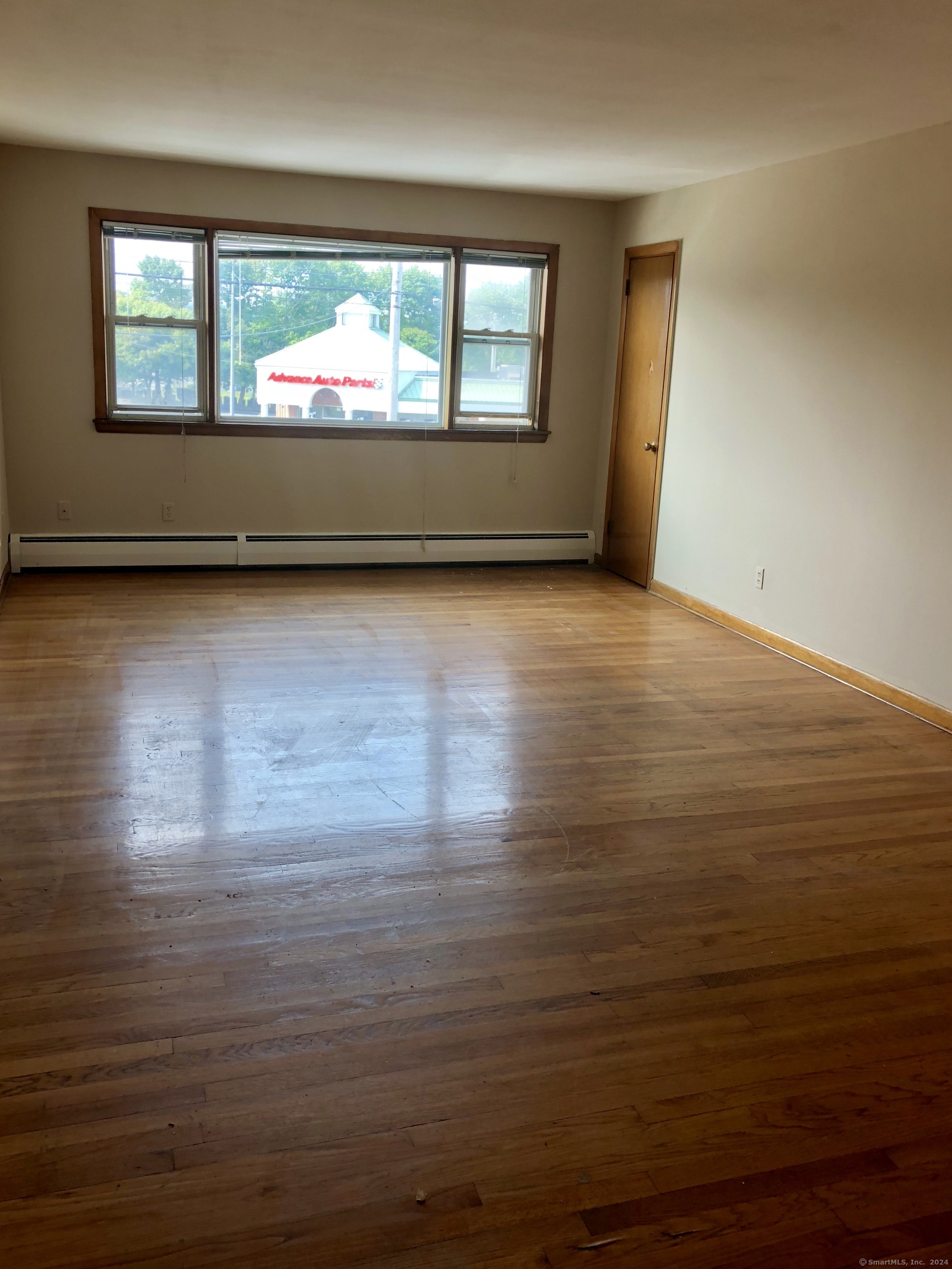 910 Boston Post Road, Unit 3 West Haven, CT 06516 - Photo 3 of 7 a view of room with window and wooden floor