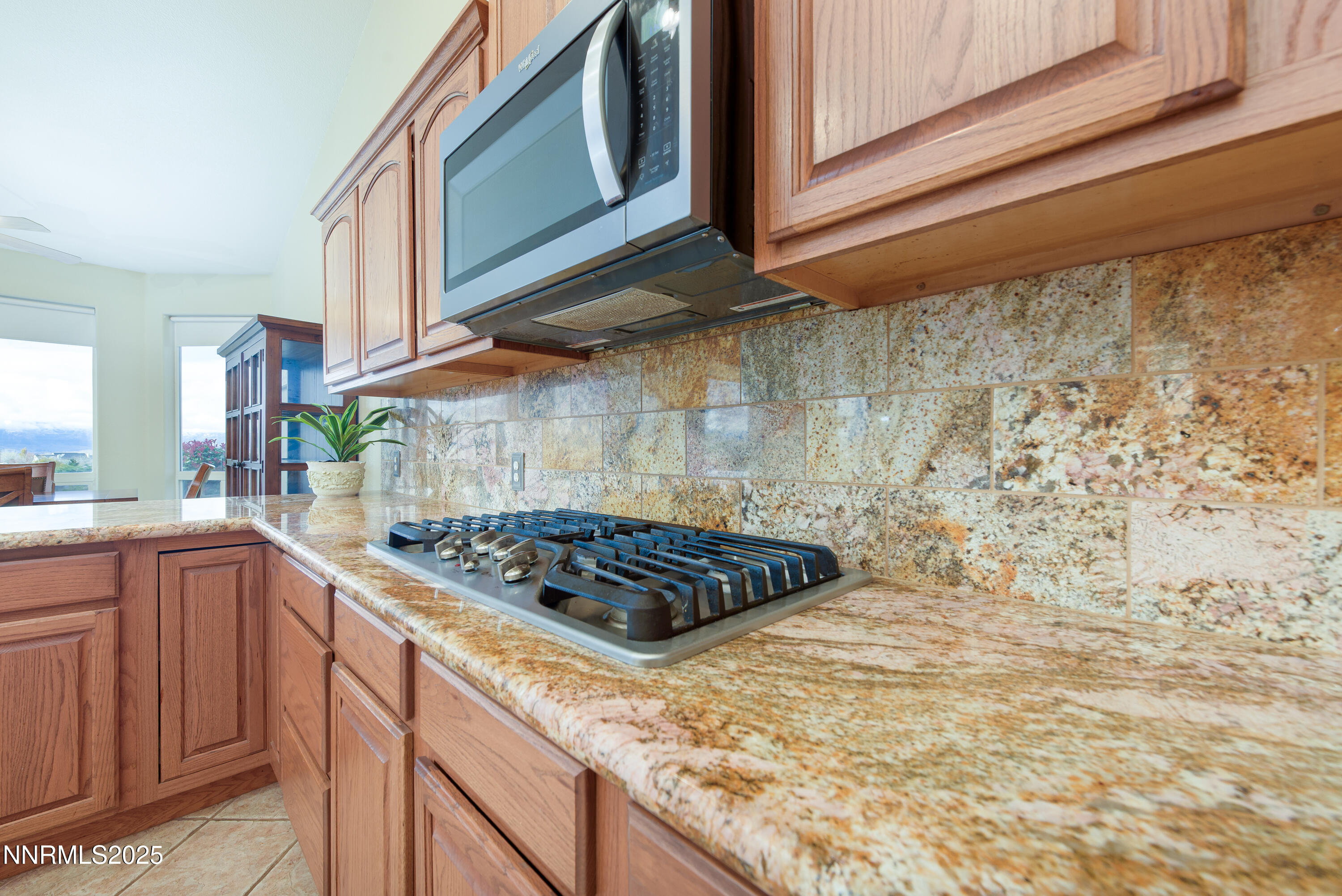1572 Sawmill Road Gardnerville, NV 89410 - Photo 17 of 43 a kitchen with a stove a sink and cabinets