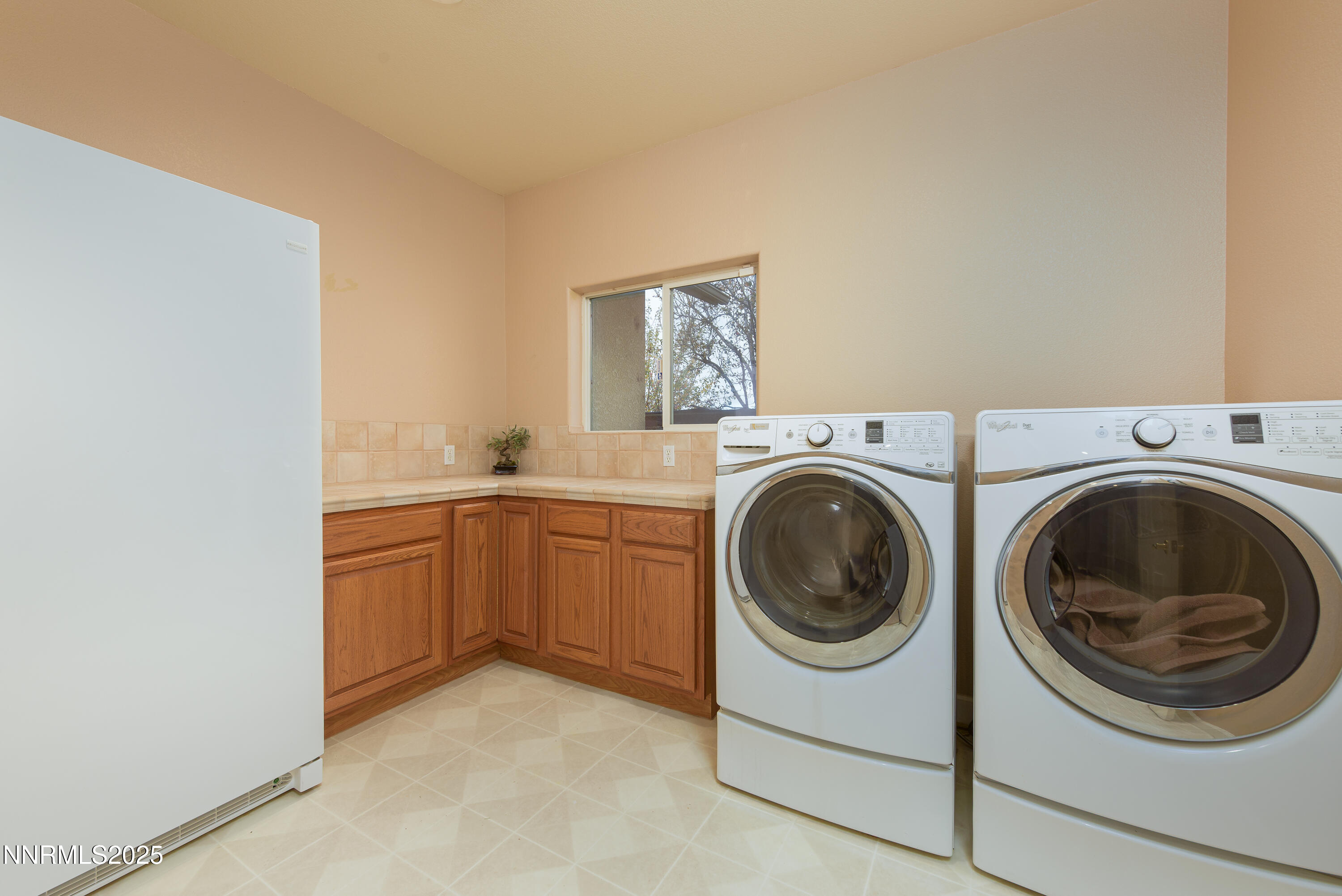 1572 Sawmill Road Gardnerville, NV 89410 - Photo 31 of 43 a utility room with sink dryer and washer