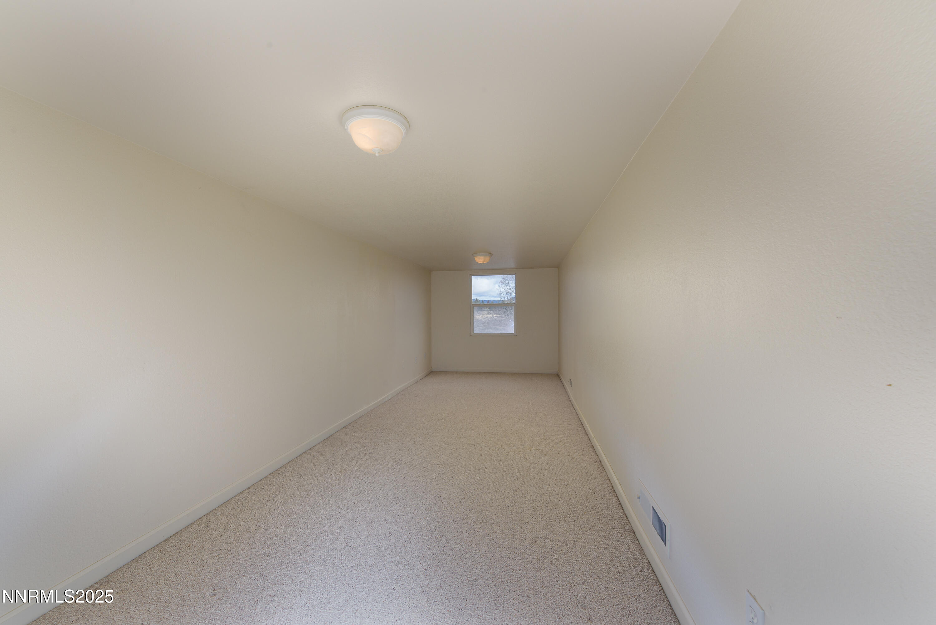 1572 Sawmill Road Gardnerville, NV 89410 - Photo 32 of 43 a view of an empty room and window