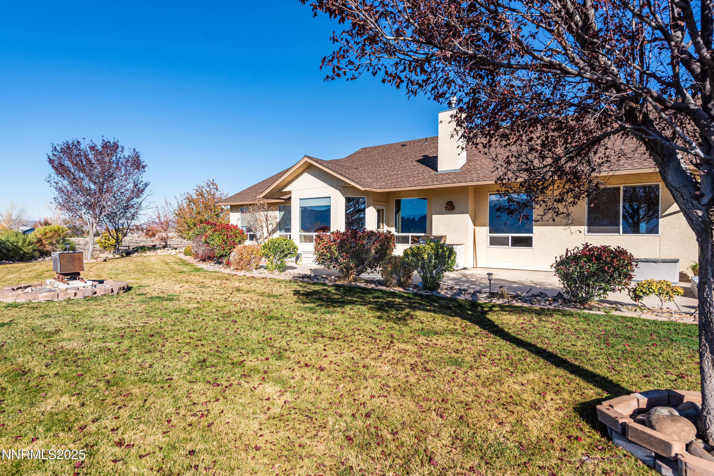 1572 Sawmill Road Gardnerville, NV 89410 - Photo 35 of 43 a front view of a house with garden