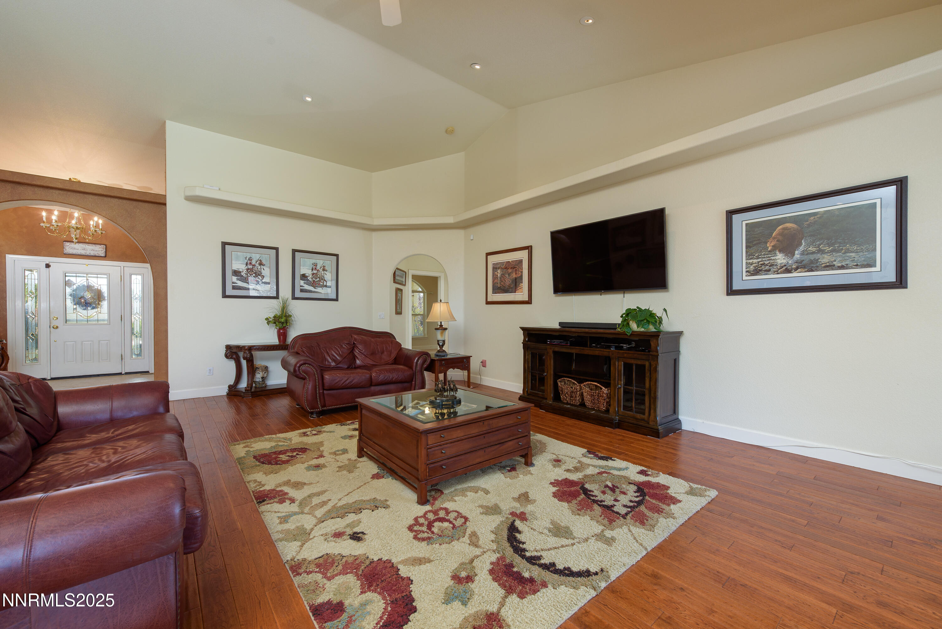 1572 Sawmill Road Gardnerville, NV 89410 - Photo 10 of 43 a living room with fireplace furniture and a flat screen tv