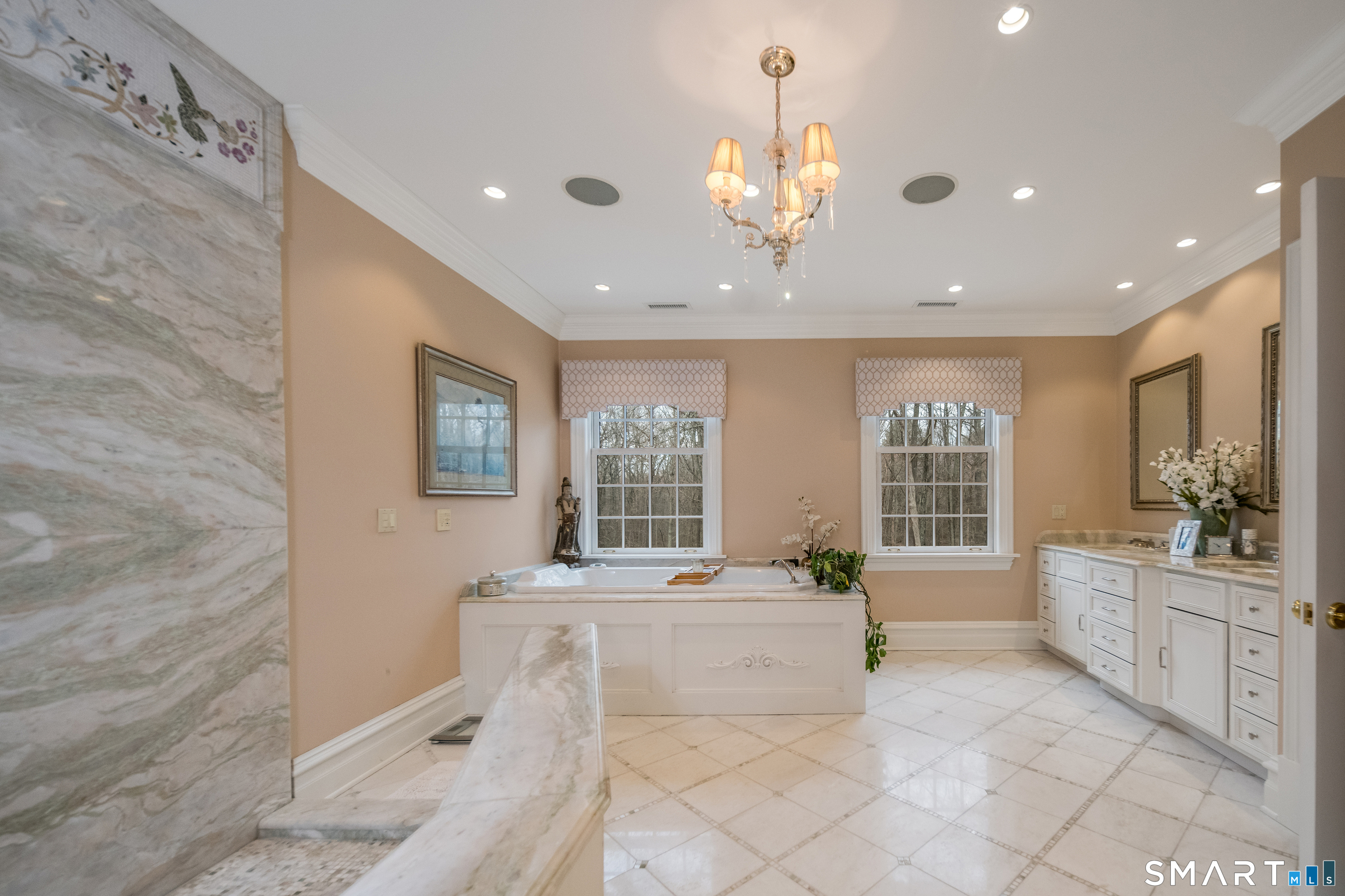 24 Indigo Trail Madison, CT 06443 - Photo 26 of 40 a large white room with a large window and chandelier