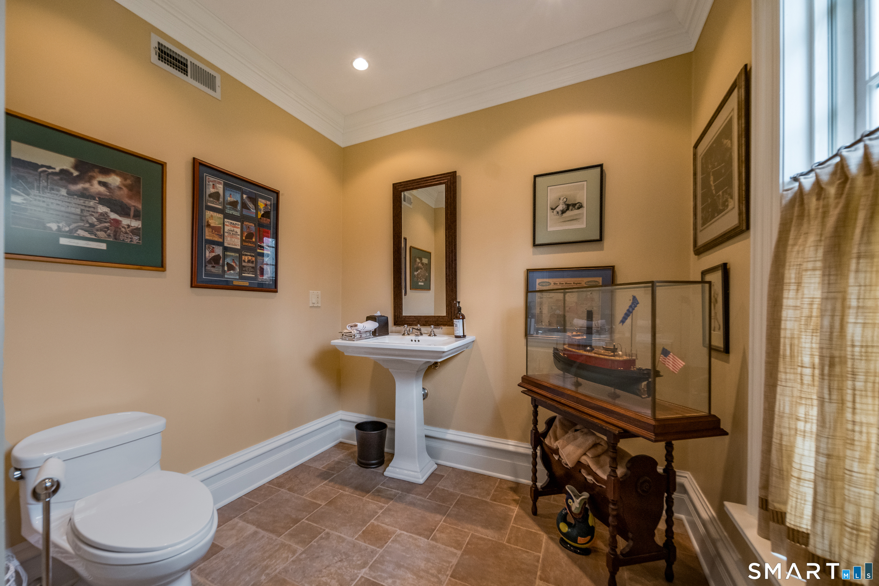 24 Indigo Trail Madison, CT 06443 - Photo 33 of 40 a bathroom with a toilet sink and mirror