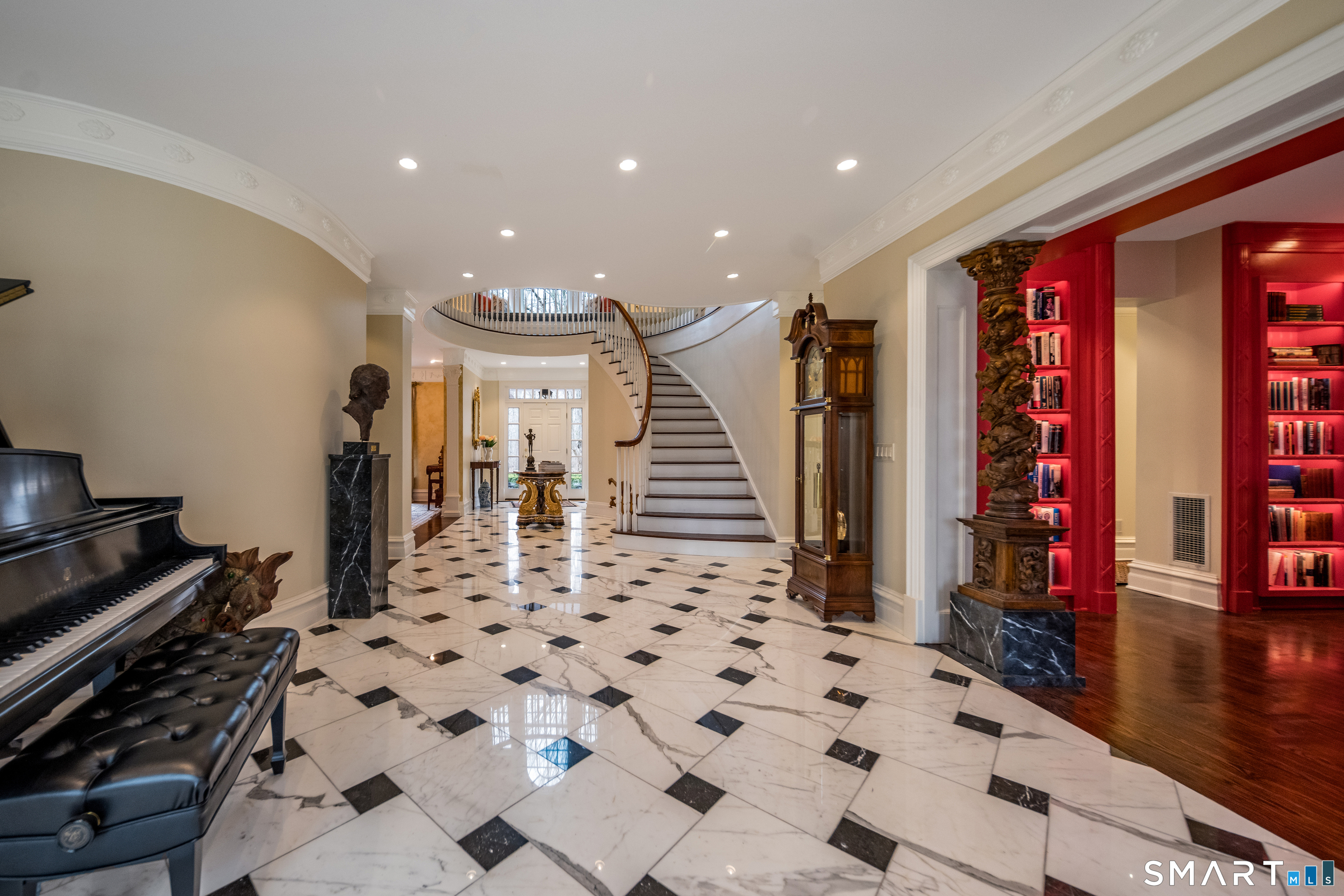 24 Indigo Trail Madison, CT 06443 - Photo 4 of 40 a view of a hallway with dining area