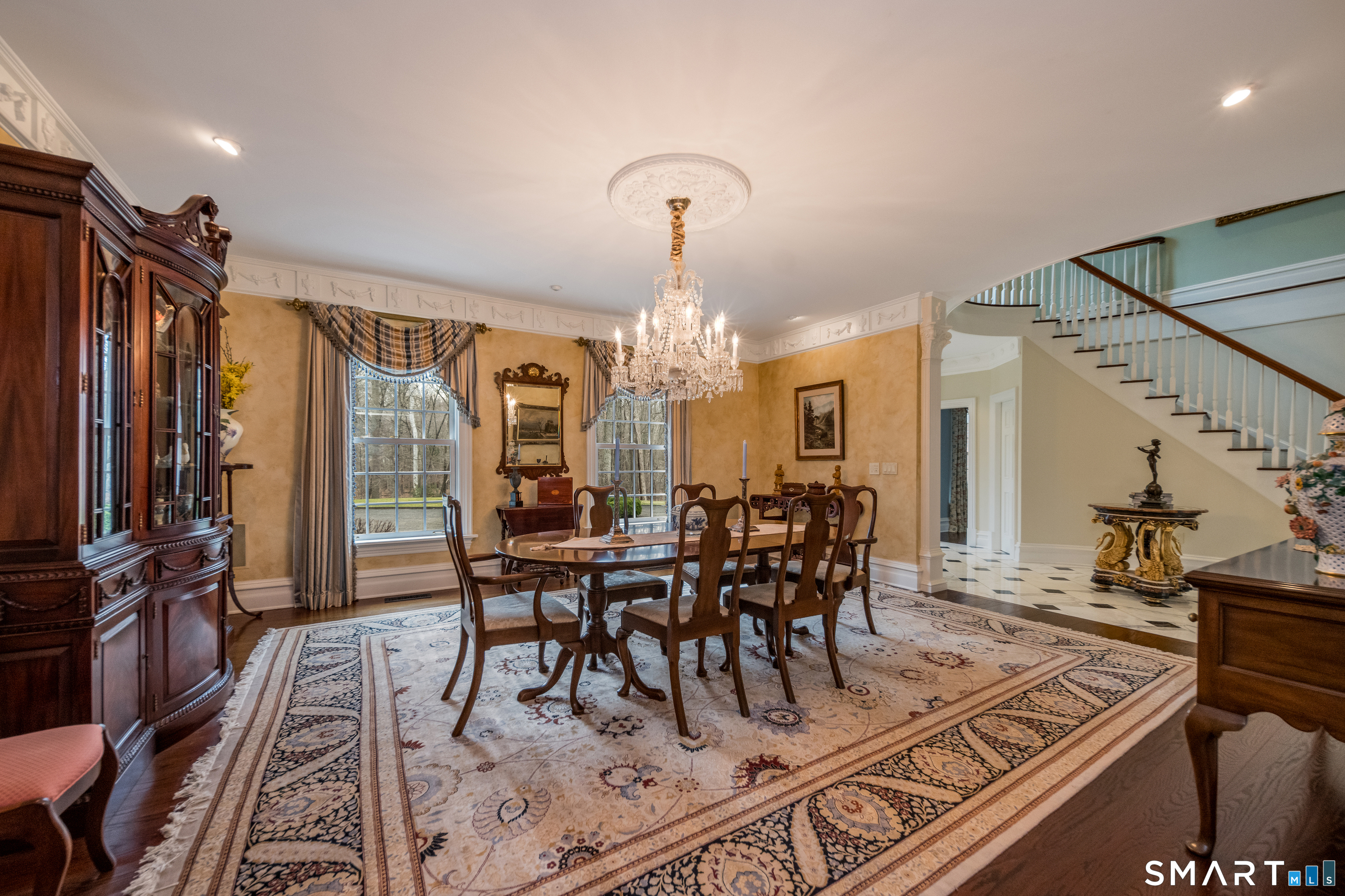 24 Indigo Trail Madison, CT 06443 - Photo 5 of 40 a view of a dining room with furniture window and wooden floor