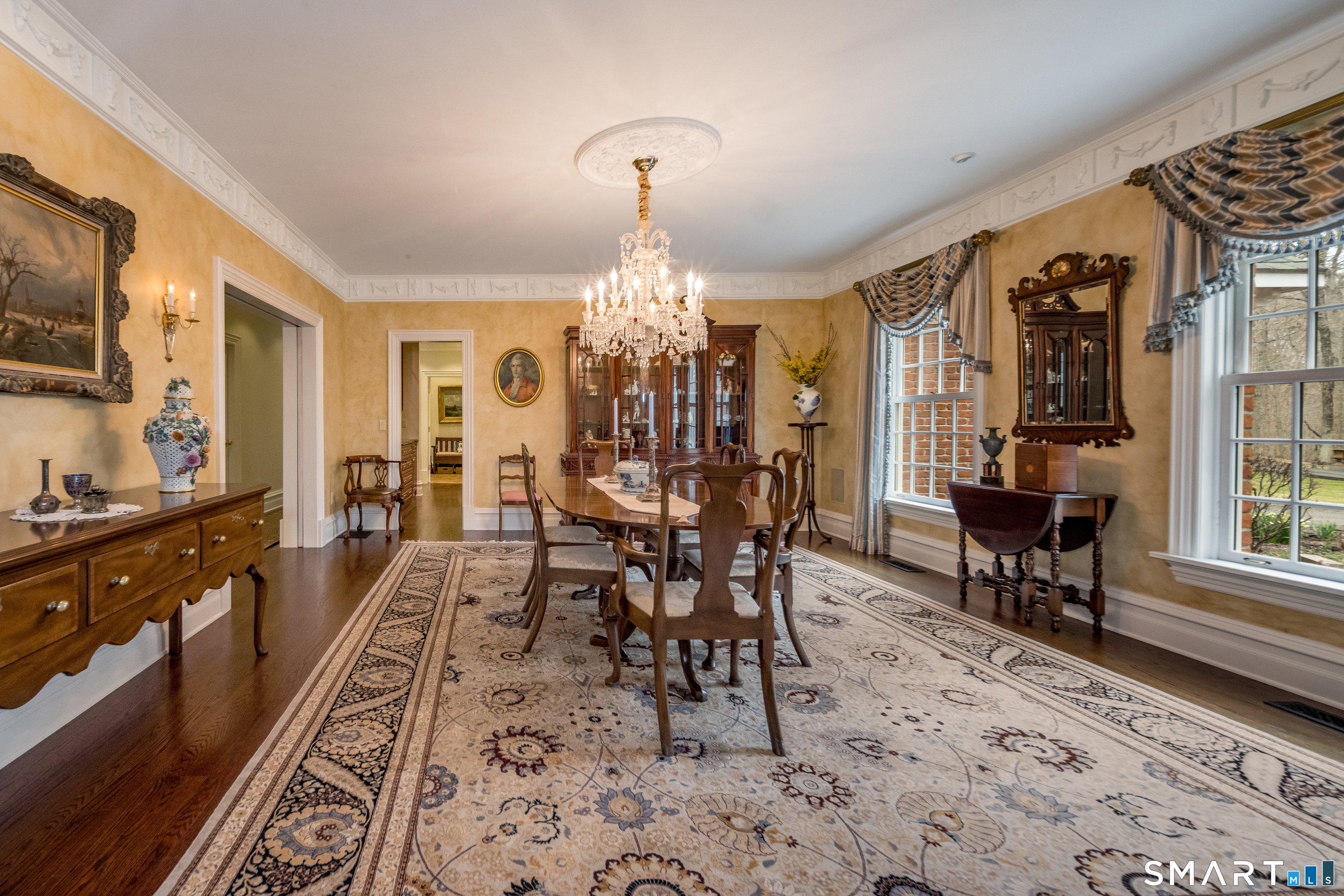 24 Indigo Trail Madison, CT 06443 - Photo 6 of 40 a view of a dining room with furniture window and wooden floor