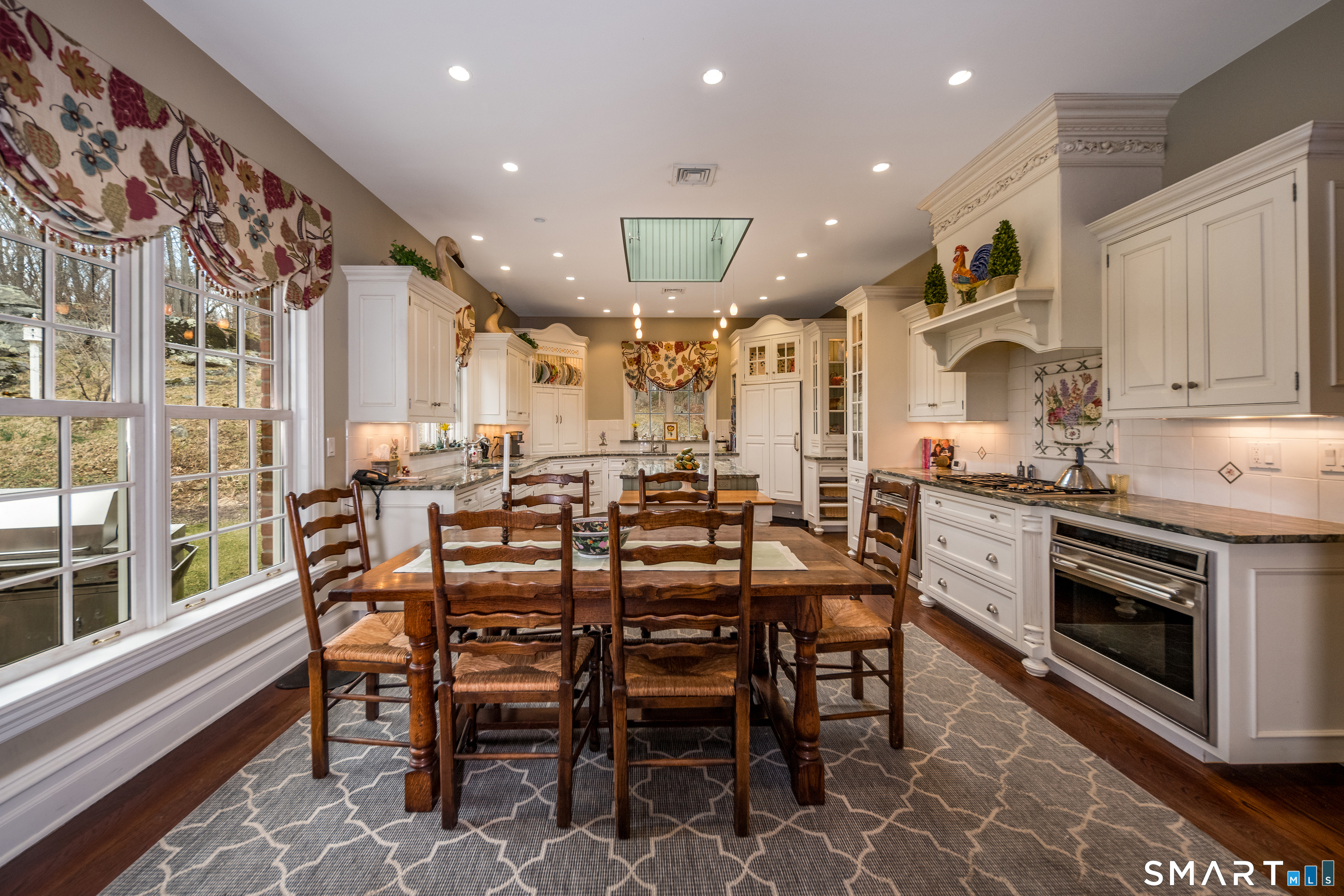 24 Indigo Trail Madison, CT 06443 - Photo 8 of 40 a large kitchen with a table and chairs
