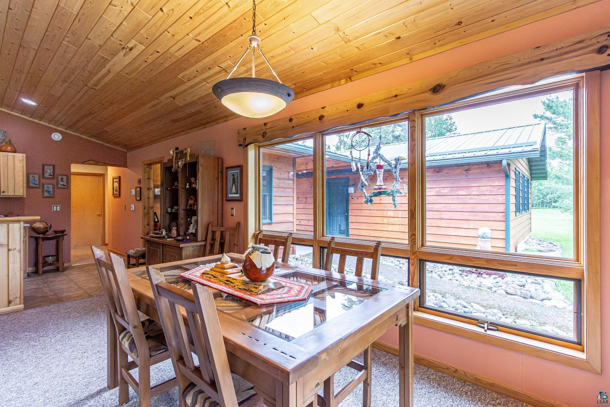 1450 Nipi Lane Isabella, MN 55607 - Photo 3 of 50 Carpeted dining room with wooden ceiling, plenty of natural light, and lofted ceiling