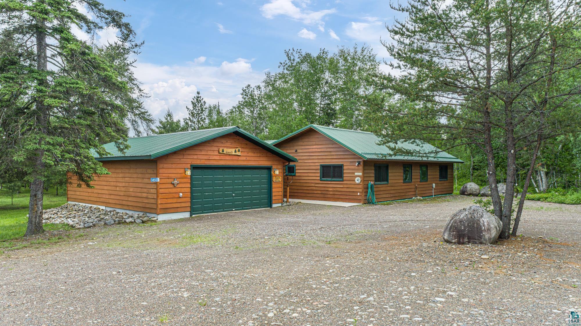 1450 Nipi Lane Isabella, MN 55607 - Photo 46 of 50 Log-style house featuring an outdoor structure and a garage